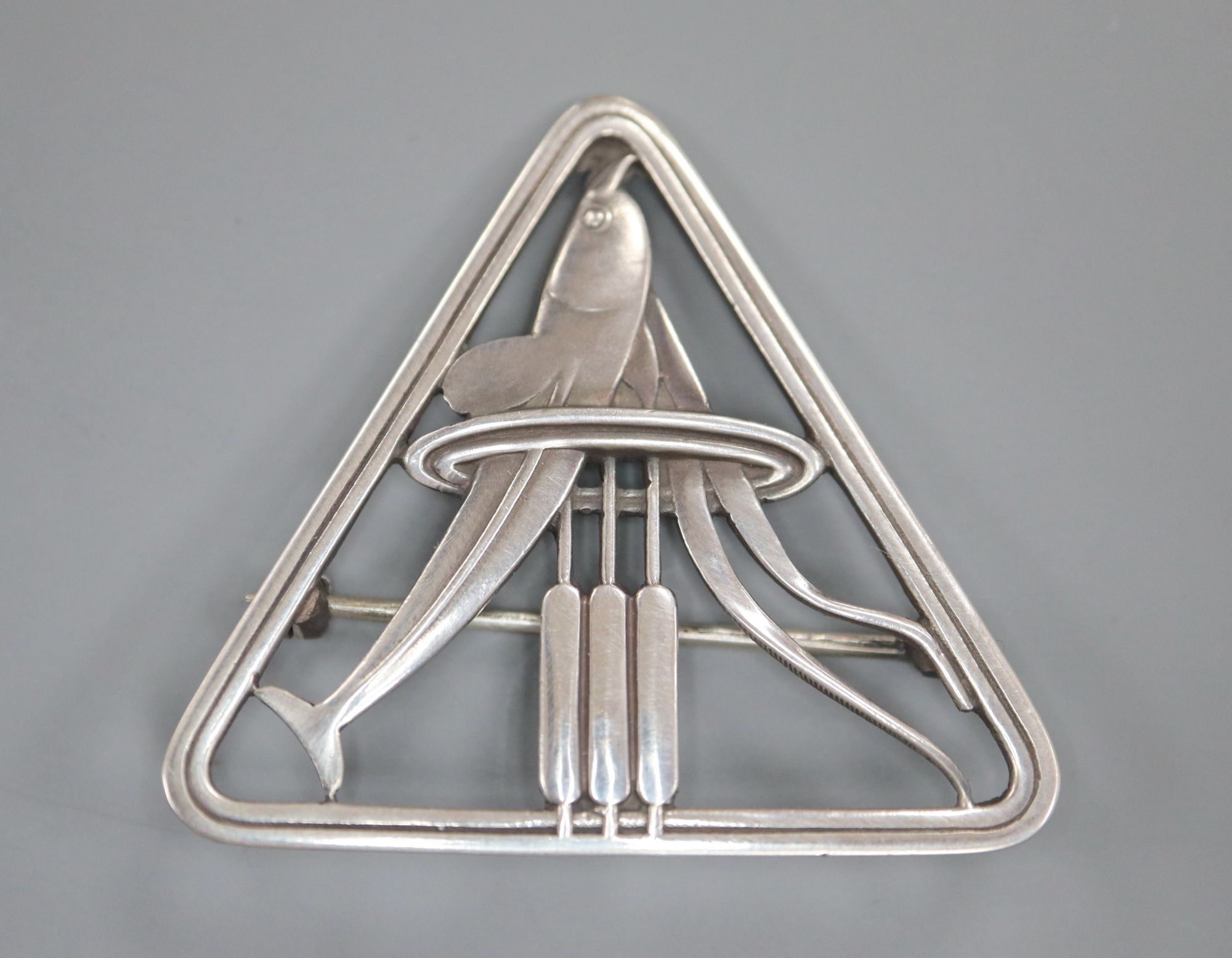 A Georg Jensen sterling Dolphin & Bulrush triangular brooch, designed by Arno Malinowski, no. 257, 37mm.